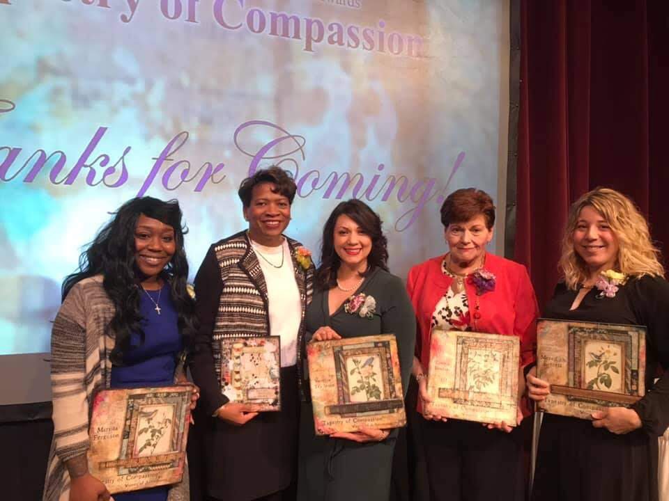 Marsita and fellow award recipients at a recognition ceremony