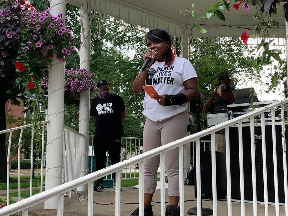 Marsita speaking at a Black Lives Matter community event at a gazebo